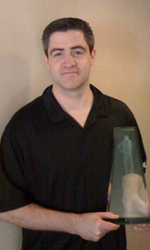 Keno Davis holds his 2008 Hugh Durham Award at the Final Four in San Antonio, TX.